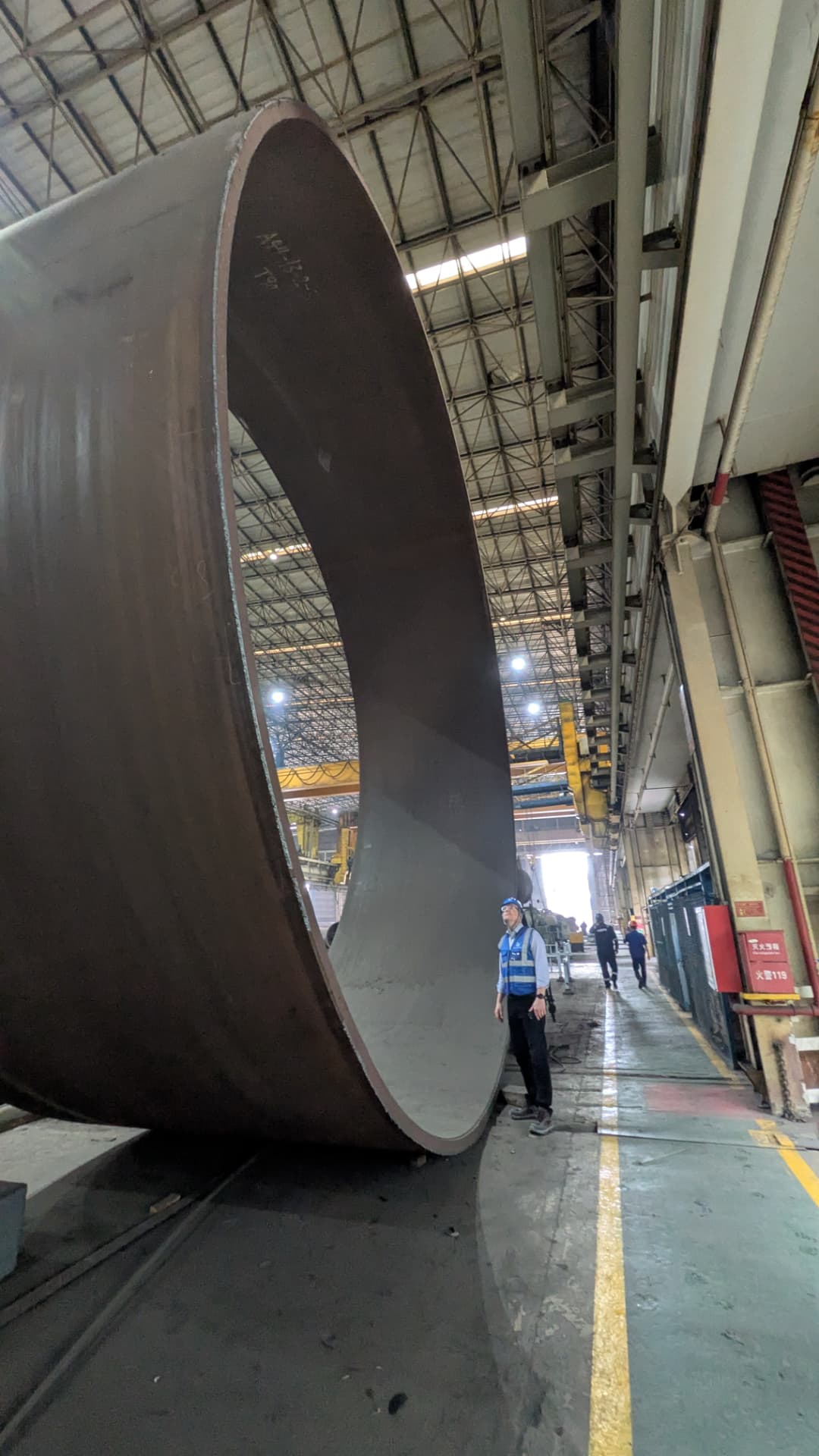 Monopile section in the fabrication hall, shown at human scale